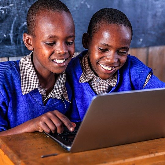 students connecting globally on laptop